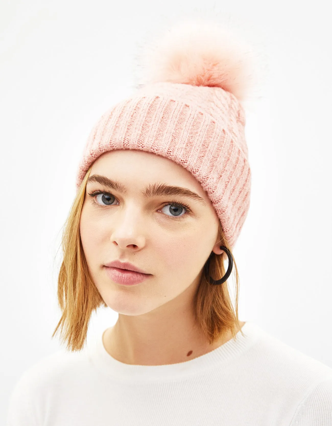 Hat with faux fur pompom