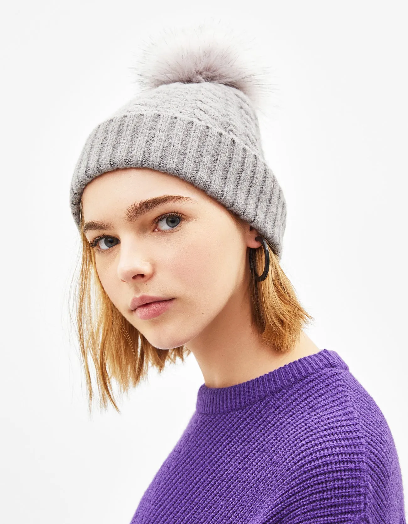 Hat with faux fur pompom