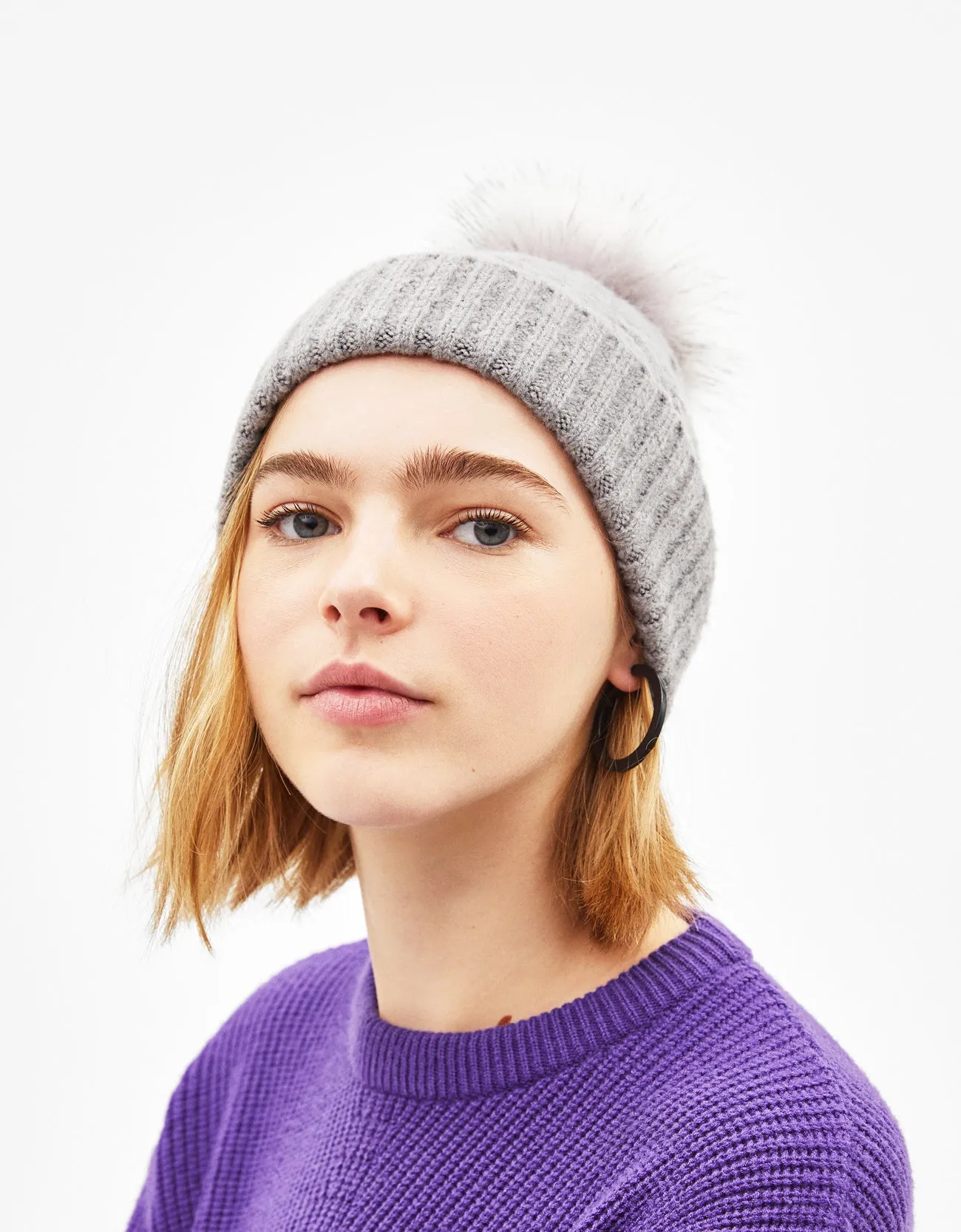 Hat with faux fur pompom