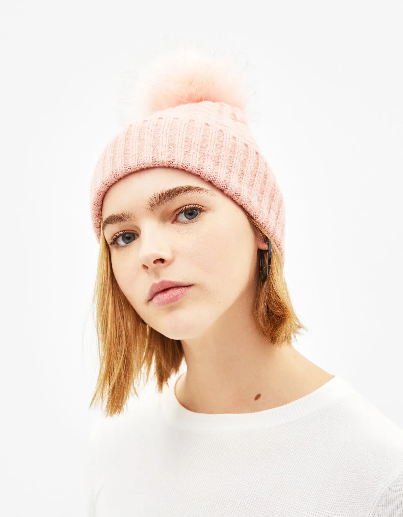 Hat with faux fur pompom